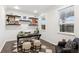 Bright home office with floating shelves, a modern desk, and ample natural light for a productive workspace at 10546 Sundial Rim Rd, Highlands Ranch, CO 80126