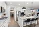 Modern kitchen offers stainless steel appliances, a marble island with seating, and ample cabinet space at 10546 Sundial Rim Rd, Highlands Ranch, CO 80126