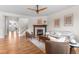 Bright living room featuring a fireplace, ceiling fan, and an abundance of natural light at 10546 Sundial Rim Rd, Highlands Ranch, CO 80126
