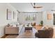 Inviting living room features hardwood floors, a large window, and comfortable seating at 10546 Sundial Rim Rd, Highlands Ranch, CO 80126