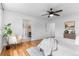 Bright main bedroom with hardwood floors, ceiling fan, and ensuite access at 10546 Sundial Rim Rd, Highlands Ranch, CO 80126