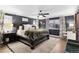 Serene main bedroom with dark walls, lots of natural light, and ample space for a sitting area at 10546 Sundial Rim Rd, Highlands Ranch, CO 80126