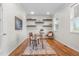 Bright office space with hardwood floors, built-in shelving, and natural light at 10546 Sundial Rim Rd, Highlands Ranch, CO 80126