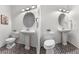 Bright powder room with a pedestal sink, toilet, and minimalist design at 10546 Sundial Rim Rd, Highlands Ranch, CO 80126