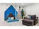 Spacious recreation room with unique climbing wall feature and comfortable seating at 10546 Sundial Rim Rd, Highlands Ranch, CO 80126