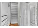 Walk-in closet with custom shelving and plenty of storage at 10546 Sundial Rim Rd, Highlands Ranch, CO 80126