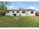 Wide backyard featuring a grill and an expansive lawn at 4972 W Custer Pl, Denver, CO 80219