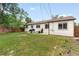 Large backyard with grill, outdoor seating, and lawn at 4972 W Custer Pl, Denver, CO 80219
