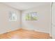 Bedroom with hardwood floors and windows providing natural light at 4972 W Custer Pl, Denver, CO 80219