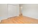 Bedroom featuring hardwood floors, closet, and neutral color scheme at 4972 W Custer Pl, Denver, CO 80219