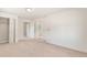 Bedroom featuring neutral carpet, a ceiling light, closet, and doorways at 4972 W Custer Pl, Denver, CO 80219