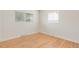 Bedroom with hardwood floors and natural light from the two windows at 4972 W Custer Pl, Denver, CO 80219