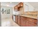 Modern kitchen featuring granite countertops, tiled backsplash, and stainless steel appliances at 4972 W Custer Pl, Denver, CO 80219