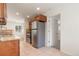 Open kitchen area featuring stainless steel appliances, granite countertops, and ample storage at 4972 W Custer Pl, Denver, CO 80219