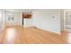 Inviting living space featuring hardwood floors and easy access to the kitchen and bathroom at 4972 W Custer Pl, Denver, CO 80219