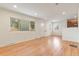 Sunlit living area showcases beautiful hardwood floors and a bright, open floor plan at 4972 W Custer Pl, Denver, CO 80219