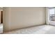 Simple carpeted bedroom with neutral walls and large window at 337 Wright St # 207, Lakewood, CO 80228