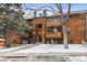 Attractive exterior of a wood-sided multi-unit building with parking and landscaping at 337 Wright St # 207, Lakewood, CO 80228