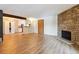 Spacious living area featuring hardwood floors and a stone fireplace at 337 Wright St # 207, Lakewood, CO 80228