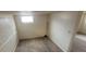 Finished basement room with carpeted floors, broom, and a window at 3601 W 80Th Ave, Westminster, CO 80031