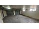Spacious basement area with concrete flooring and multiple garage doors at 3601 W 80Th Ave, Westminster, CO 80031