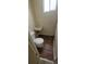 Bathroom featuring a toilet, a sink, a small window, and tile backsplash at 3601 W 80Th Ave, Westminster, CO 80031