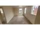 Bright and neutral bedroom with carpeted floors and multiple windows for natural light at 3601 W 80Th Ave, Westminster, CO 80031