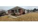 Lovely brick home with a covered front porch and a manicured lawn, perfect for a Gathering at 3601 W 80Th Ave, Westminster, CO 80031
