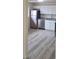 This kitchen features gray flooring, stainless steel appliances, white cabinets, and granite countertops at 3601 W 80Th Ave, Westminster, CO 80031