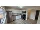 Updated kitchen with stainless steel appliances, granite countertops, ample cabinet space, and modern flooring at 3601 W 80Th Ave, Westminster, CO 80031