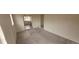 Cozy living room with carpeted floors, neutral paint, and an open layout at 3601 W 80Th Ave, Westminster, CO 80031