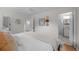 Bright bedroom featuring hardwood floors, ensuite bathroom and walk in closet at 6402 Iris Ct, Arvada, CO 80004