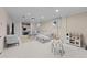 Spacious carpeted living room features a comfortable gray sectional and built-in shelving at 6402 Iris Ct, Arvada, CO 80004