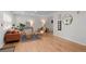 Airy living room with hardwood floors, modern decor, and ample natural light create an inviting atmosphere at 6402 Iris Ct, Arvada, CO 80004