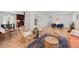 Open living area with hardwood floors, connected to the kitchen, offers a stylish and functional layout at 6402 Iris Ct, Arvada, CO 80004