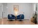 Stylish sitting area with comfortable seating and a minimalist design, providing a relaxing and modern atmosphere at 6402 Iris Ct, Arvada, CO 80004