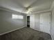 Bedroom with grey carpet, ceiling fan, and a double-door closet at 2670 S Hooker St, Denver, CO 80219