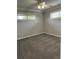 Bedroom with grey carpet, ceiling fan, and window with blinds at 2670 S Hooker St, Denver, CO 80219