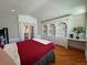 Bedroom with built-in shelving and hardwood floors at 2670 S Hooker St, Denver, CO 80219