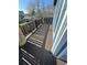 Dark brown stained deck with stone and wood railings at 2670 S Hooker St, Denver, CO 80219