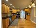 Kitchen boasts wood cabinets, granite countertops, and stainless steel appliances at 2670 S Hooker St, Denver, CO 80219