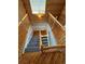 Overhead view of a wooden staircase with gray carpet at 2670 S Hooker St, Denver, CO 80219