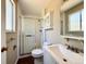 Clean bathroom features a shower, toilet, vanity with sink, and a mirrored cabinet at 7195 E Louisiana Ave, Denver, CO 80224