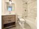 Bathroom featuring a shower-tub combo, vanity and sink, and toilet at 7195 E Louisiana Ave, Denver, CO 80224
