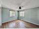 Bedroom with two windows, a ceiling fan, and hardwood floors at 7195 E Louisiana Ave, Denver, CO 80224