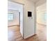 Hallway features hardwood floors, connecting different bedrooms and parts of the house at 7195 E Louisiana Ave, Denver, CO 80224