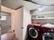 Laundry room with red washer and dryer at 7195 E Louisiana Ave, Denver, CO 80224