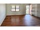 Inviting living room featuring hardwood floors and a view of the outdoors through a window and door at 7195 E Louisiana Ave, Denver, CO 80224