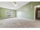 Spacious bedroom featuring neutral carpet, a ceiling fan and lots of natural light at 3022 S Wheeling Way # 407, Aurora, CO 80014