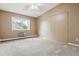 Spacious bedroom featuring neutral carpet, a ceiling fan and natural light at 3022 S Wheeling Way # 407, Aurora, CO 80014